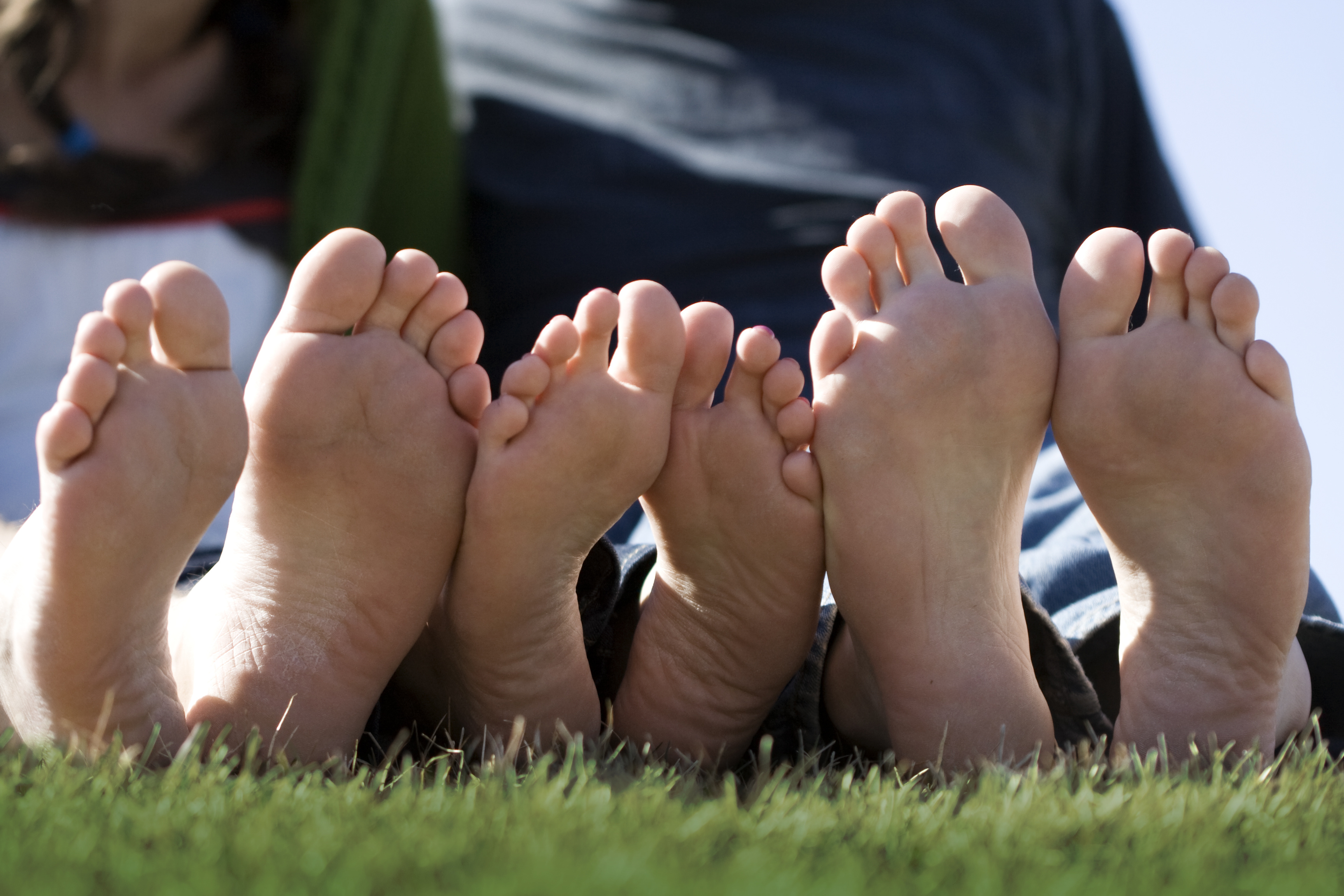 3 pairs of bare feet